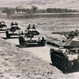 Poles, tanks heading up teh road from Whiteadder valley.jpg